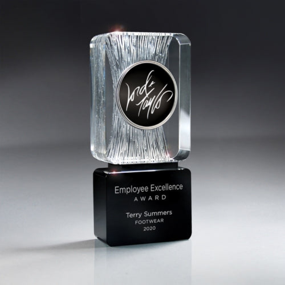 Carved Clear Crystal on Black Base with Logo Medallion — 6 1/2" x 3" x 1 1/4" Sold only as shown.